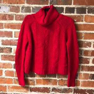 Cropped red cable knit sweater